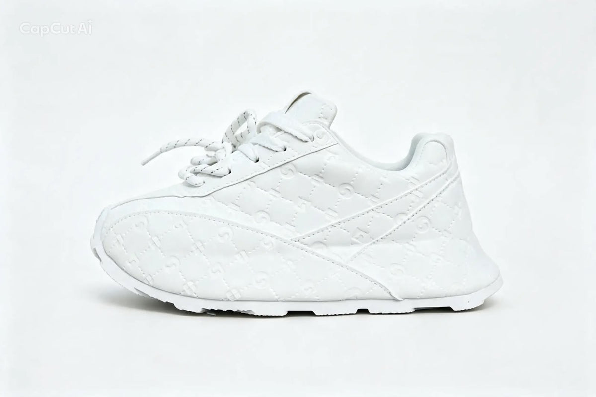 This appears to be a pair of white low-top casual sneakers featuring an all-over embossed monogram pattern and a chunky sole