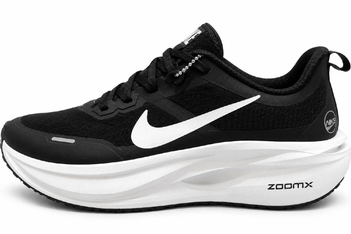 <h4 style="text-align: center;"><strong>This appears to be a black Nike ZoomX Premium running sneaker featuring a prominent white Swoosh and a thick cushioned midsole.</strong></h4>